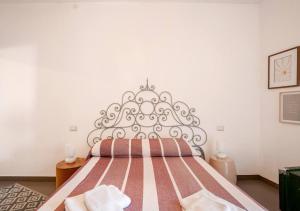 a bedroom with a bed with a metal headboard at Norma House on the Rocks in Norma