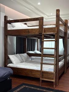 a couple of bunk beds in a room at Jazzy Pool Villa Hatyai in Hat Yai