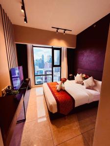 Ένα ή περισσότερα κρεβάτια σε δωμάτιο στο LUXURY AXON SUITES KLCC PAVILION At BUKIT BINTANG +124 φωτογραφίες