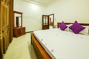 Ένα ή περισσότερα κρεβάτια σε δωμάτιο στο Ocean Hill Ahungalla