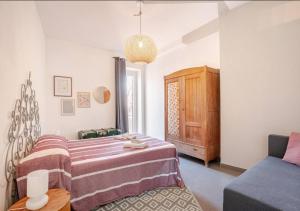 a bedroom with a bed and a couch at Norma House on the Rocks in Norma