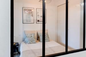 Ένα ή περισσότερα κρεβάτια σε δωμάτιο στο Le confortable - Proche gare -