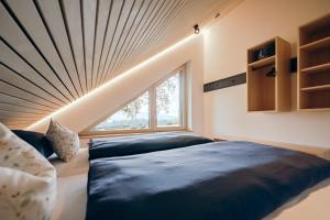 Postel nebo postele na pokoji v ubytování Lindenhof Chalets