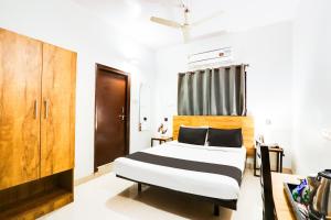 Ένα ή περισσότερα κρεβάτια σε δωμάτιο στο Hotel O Dream Nest