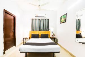 Ένα ή περισσότερα κρεβάτια σε δωμάτιο στο Hotel O Dream Nest +21 φωτογραφίες