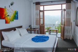 Postel nebo postele na pokoji v ubytování New Ella Nature View