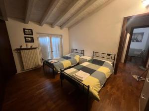 Ένα ή περισσότερα κρεβάτια σε δωμάτιο στο Terrazza su Volta Mantovana