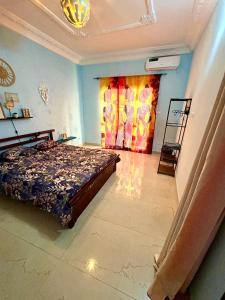 Ένα ή περισσότερα κρεβάτια σε δωμάτιο στο Home TERANGA hébergement au premier étage