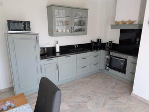 Kuchyň nebo kuchyňský kout v ubytování Ferienhaus MAWO