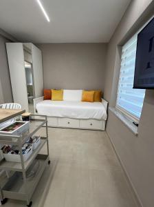 a bedroom with a bed and a tv in it at IsabellaGuestHouse in Chiusa di Pesio