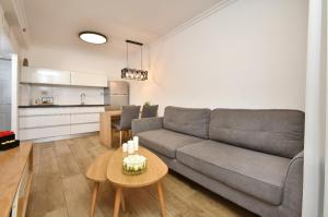 a living room with a couch and a table at sea of Galilee 612 in Tiberias