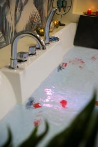 a bathroom sink with red paint on top of it at Attimo d'amore in Quinto Vicentino