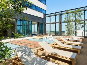 a view from the top of a building with a pool at Mitsui Garden Hotel Yokohama Minatomirai Premier in Yokohama
