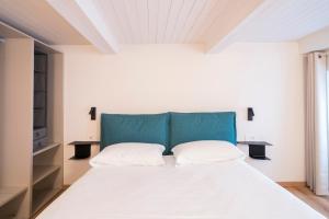 Ένα ή περισσότερα κρεβάτια σε δωμάτιο στο Aosta Holiday Apartments - Croix-de-Ville