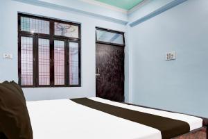 Voodi või voodid majutusasutuse Hotel O Om Sai Garden toas +21 fotot