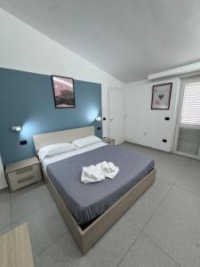 Postel nebo postele na pokoji v ubytování Alura Apartments