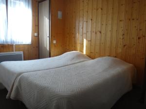 Postel nebo postele na pokoji v ubytování Chalet Gabriel