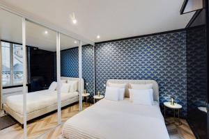 Postel nebo postele na pokoji v ubytování L'Appart Cosy- Hyper centre- Vue sur la collégiale