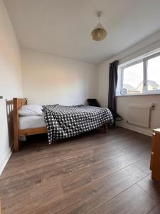 Ένα ή περισσότερα κρεβάτια σε δωμάτιο στο CW Apartments