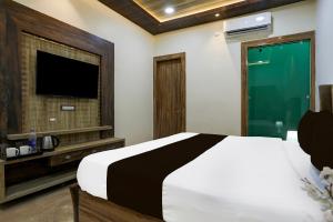 Postel nebo postele na pokoji v ubytování Hotel O Lax