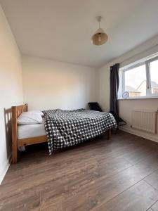 Ένα ή περισσότερα κρεβάτια σε δωμάτιο στο CW Apartments