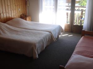 A bed or beds in a room at Chalet Gabriel
