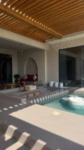 a rendering of a living room with a pool at Paradise Vine in Barka