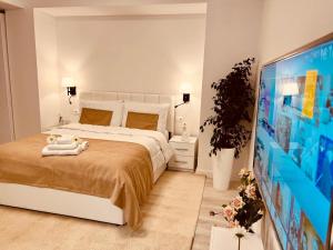 Ένα ή περισσότερα κρεβάτια σε δωμάτιο στο Wilson Garden view Tirana