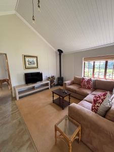 a living room with a couch and a coffee table at Westview Estate in Shawlands