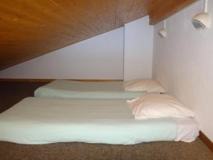 Postel nebo postele na pokoji v ubytování Chalet Gabriel