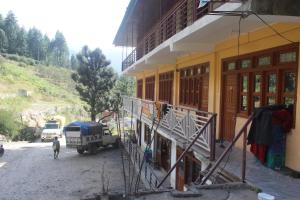 a building is being constructed next to a building at Hotel SSS The Chanshal Retreat in Khashdhār