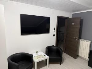 TV a/nebo společenská místnost v ubytování Room Aria