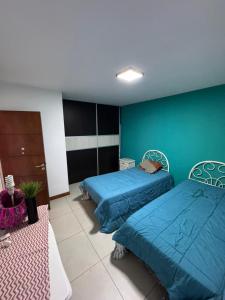 Ένα ή περισσότερα κρεβάτια σε δωμάτιο στο Lujoso y amplio departamento en alquiler