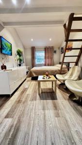 a bedroom with a bunk bed and a table at Sleep with the stars in Oslo