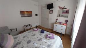 Postel nebo postele na pokoji v ubytování Affittacamere BaLu