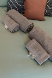 a group of rolled up towels on a bed at Welverdiend - Unit 1 in Bloemfontein