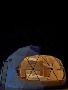 a tent with a box inside of it at Sultan Luxury Camp in Wadi Rum