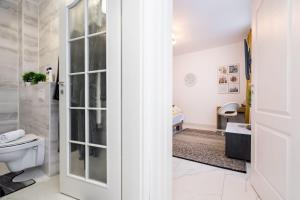 a bathroom with a toilet and a sink at Hotel Avner in Bucharest +182 photos