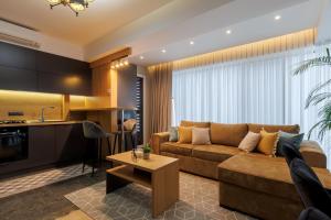 a living room with a couch and a table at Renest New York Skyline View in Chişinău +142 photos