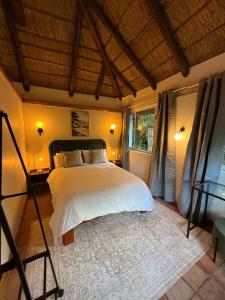 Ένα ή περισσότερα κρεβάτια σε δωμάτιο στο Tranquility