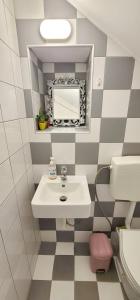 a bathroom with a sink and a mirror at Harmony Apartment Pythagoreio Samos Center in Pythagoreio +25 photos