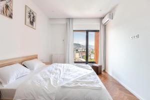 Ένα ή περισσότερα κρεβάτια σε δωμάτιο στο Hilton Blox Avlabari Apartment