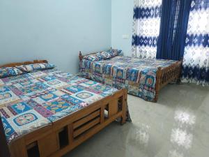 Postel nebo postele na pokoji v ubytování Hridhayam Homestay varkala + 12 fotografií