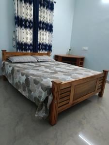 Ένα ή περισσότερα κρεβάτια σε δωμάτιο στο Hridhayam Homestay varkala +13 φωτογραφίες