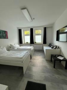 Postel nebo postele na pokoji v ubytování Freshly renovated City Apartments Essen KITCHEN WIFI near Düsseldorf Airport