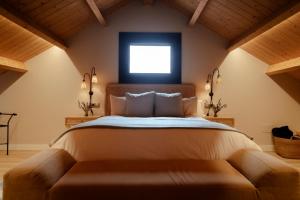 a bedroom with a large bed and a window at Casa Chare in Moaña +20 photos