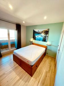 Postel nebo postele na pokoji v ubytování Appartement familial 4 personnes plus 1 bébé