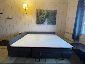 Postel nebo postele na pokoji v ubytování Appartement familial 4 personnes plus 1 bébé