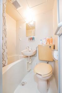 a bathroom with a toilet and a sink at sakura 403 in Tokyo