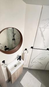 a bathroom with a sink and a shower at Villa Dominique in Villas del Mar